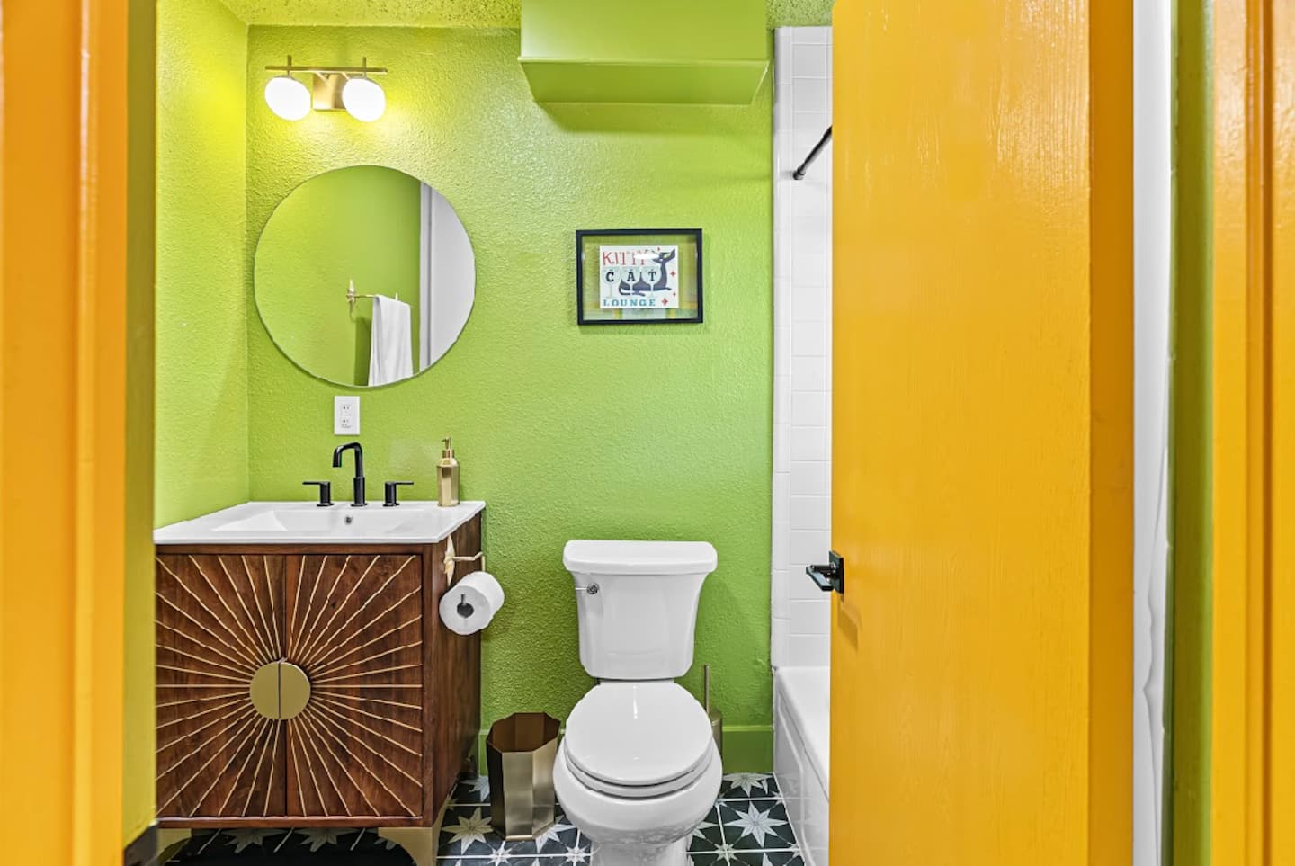 Green upstairs bathroom with a tub and shower